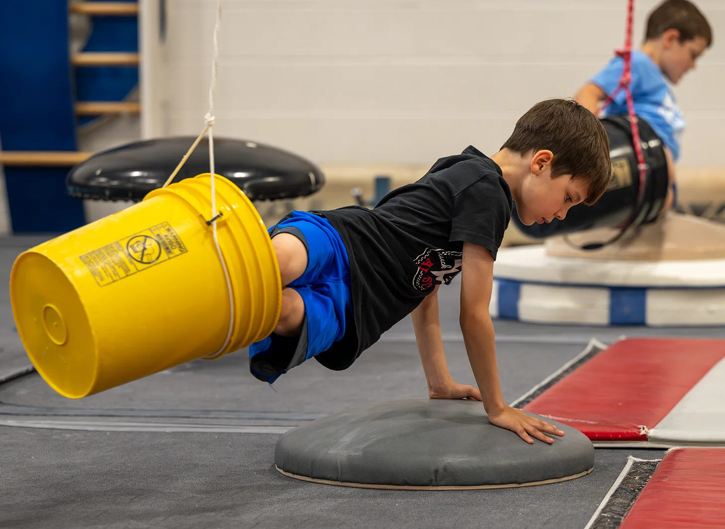 Boys gymnastics team working on skills