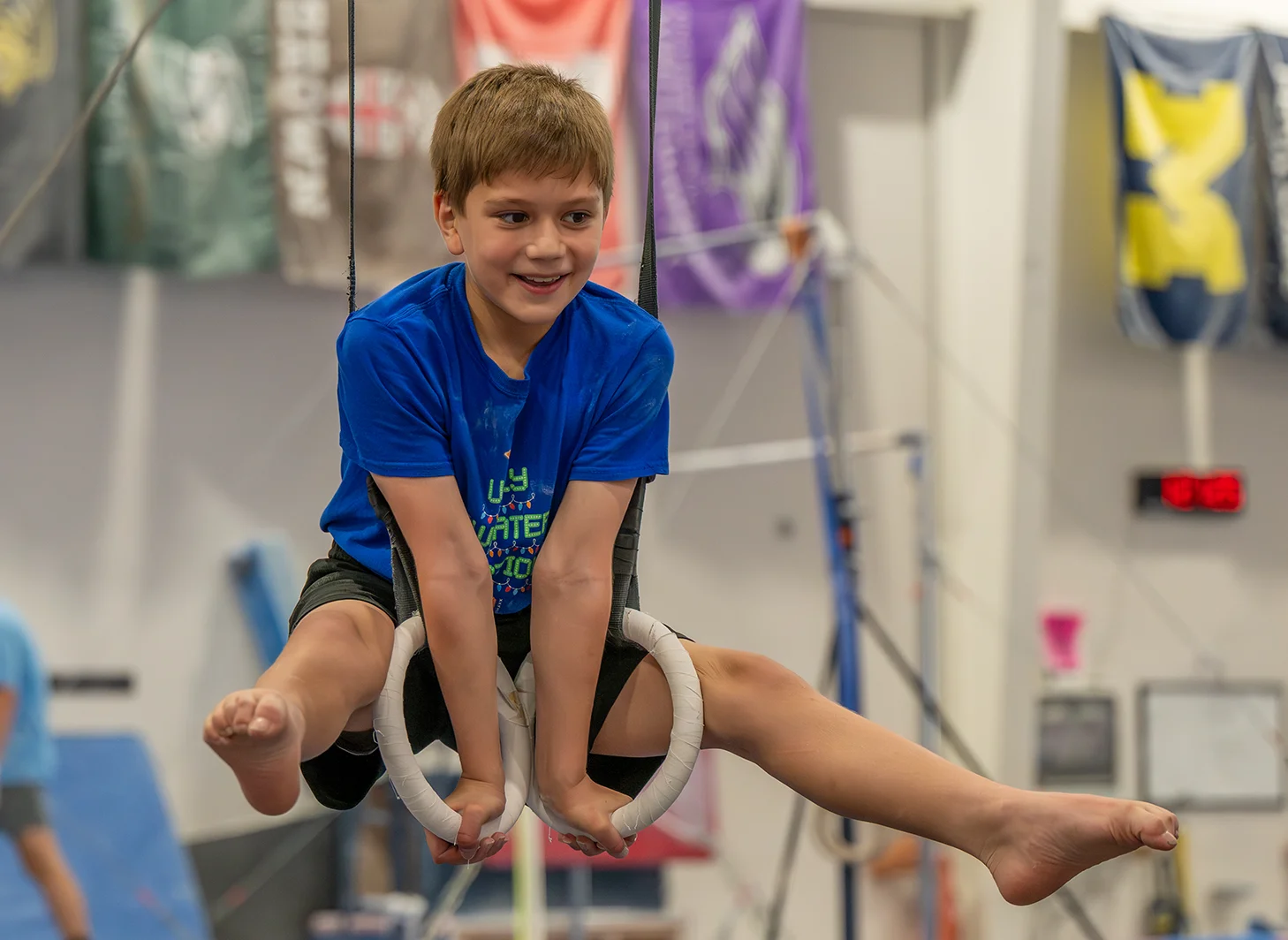 Boys Gymnastics Team Member on rings