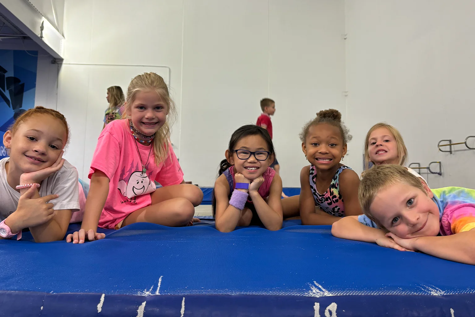 Group of kids on mat during school break camp